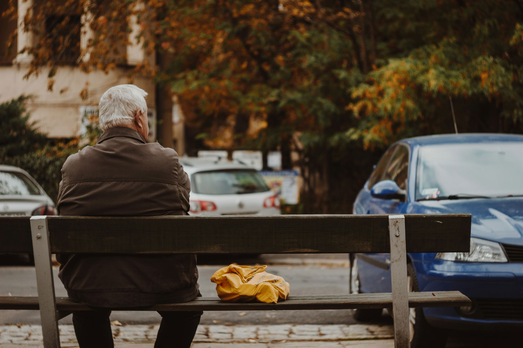 man-sitting-on-bench.jpg man sitting on bench